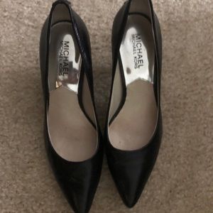 Michael Kors black pointed toe pumps.